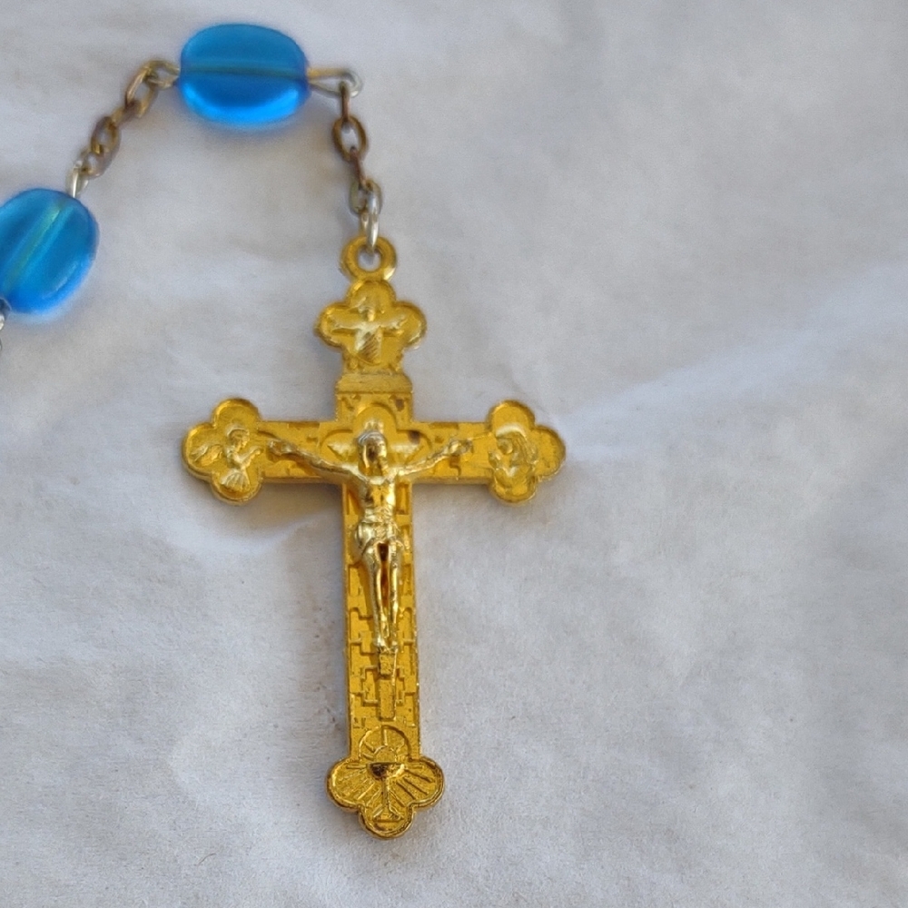 Gold Tone Crucifix Pendant with Blue Beads